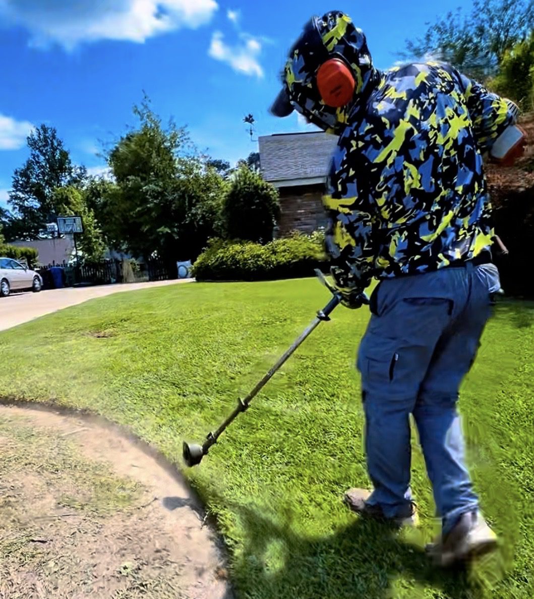 Josh the founder of SouthScape Co. string trimmer lawn edging in Hattiesburg Mississippi